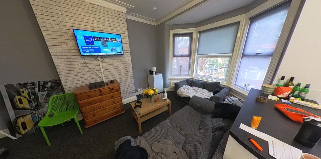 A bright and spacious living room with ample na...
