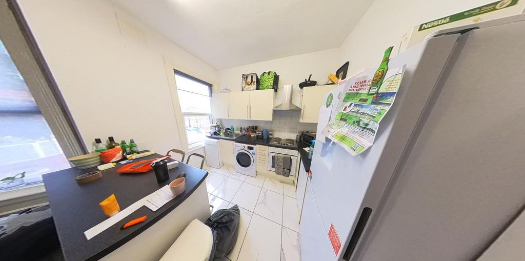 A bright and functional kitchen with good natur...
