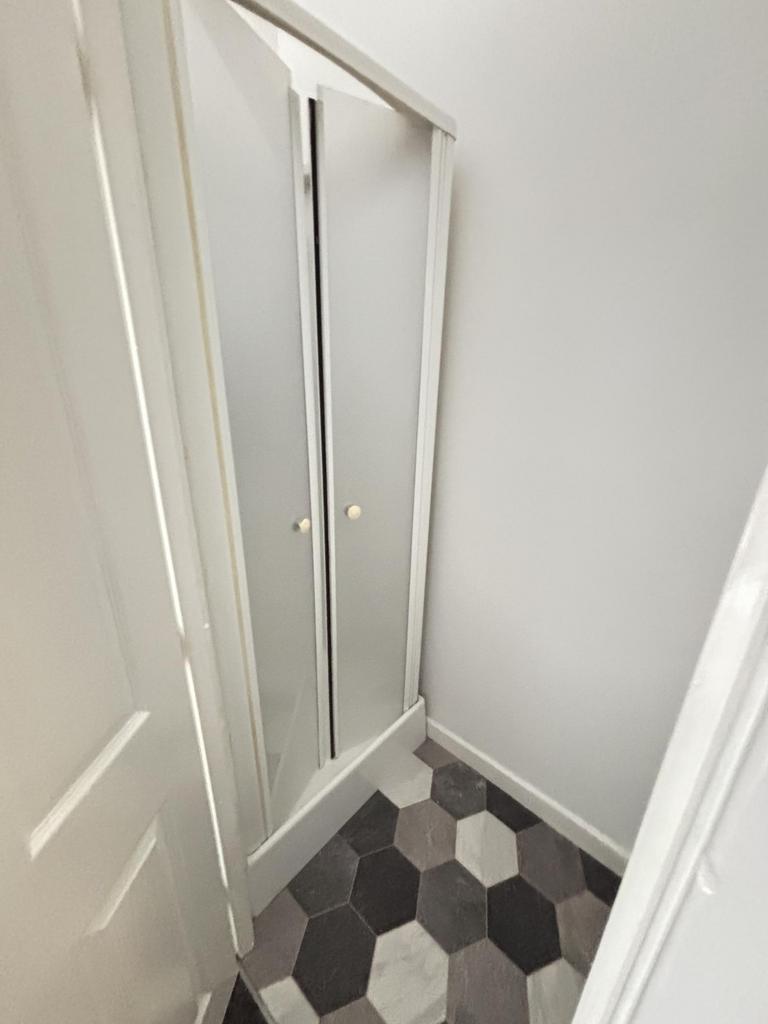 A clean, well-maintained bathroom with tiled fl...