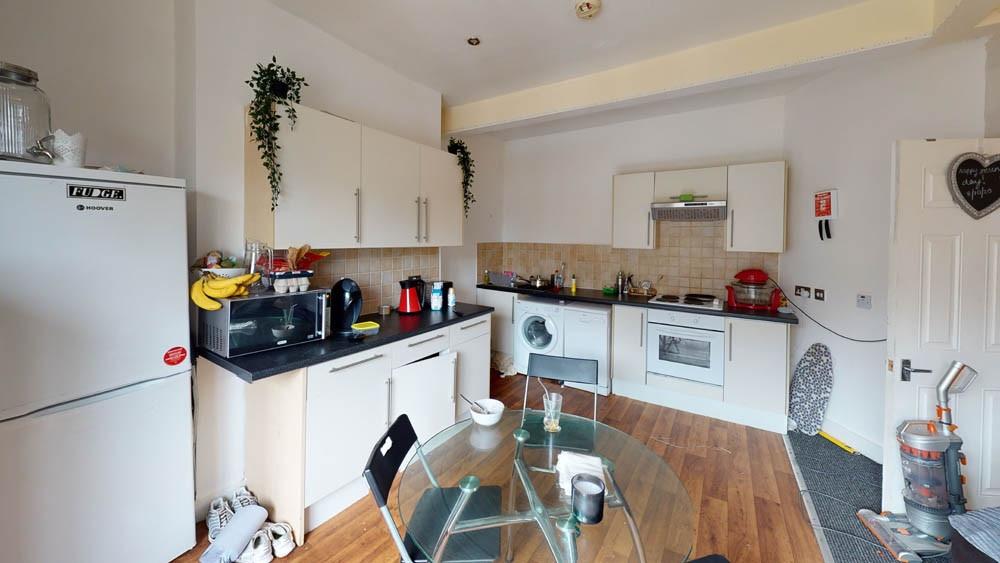 A bright and modern kitchen with ample counter ...