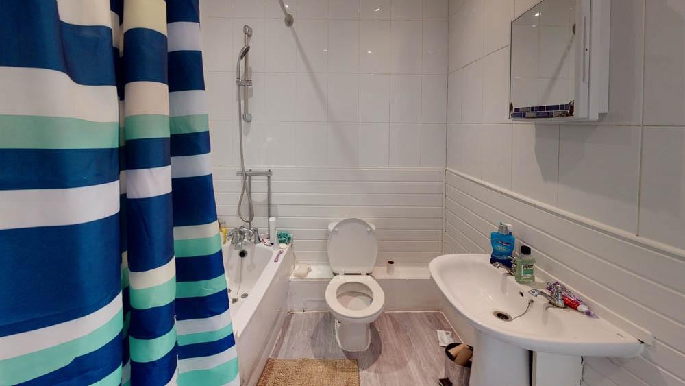 A clean and well-maintained bathroom featuring ...