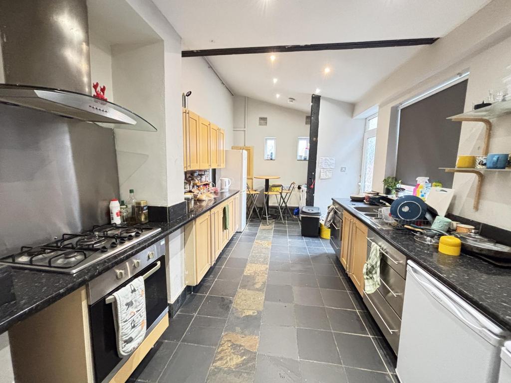 Modern and well-maintained kitchen with ample c...