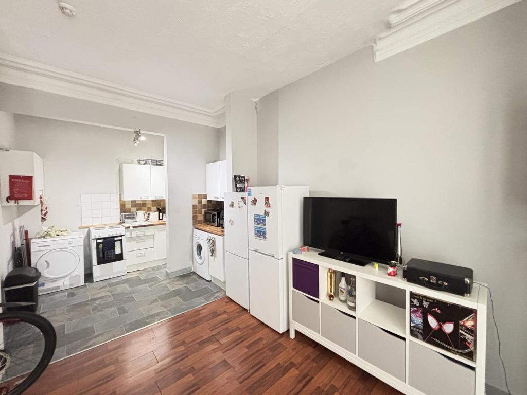 A bright and spacious living room featuring a m...