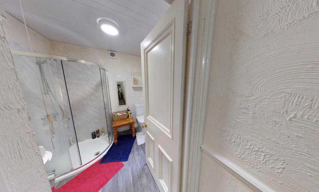A modern, well-maintained bathroom with a large...