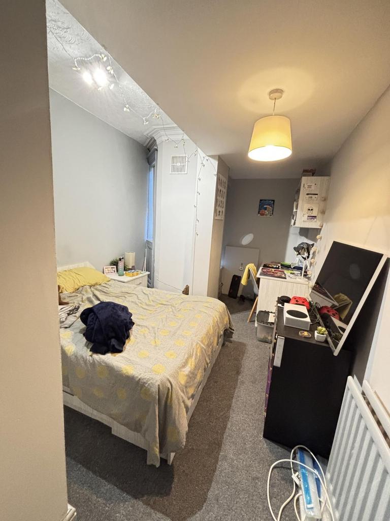 A spacious master bedroom with ample space for ...