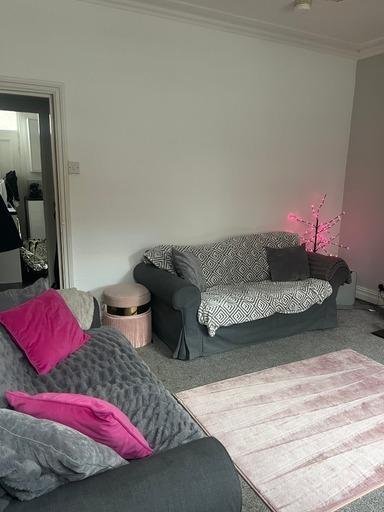 Bright and inviting living room featuring comfo...