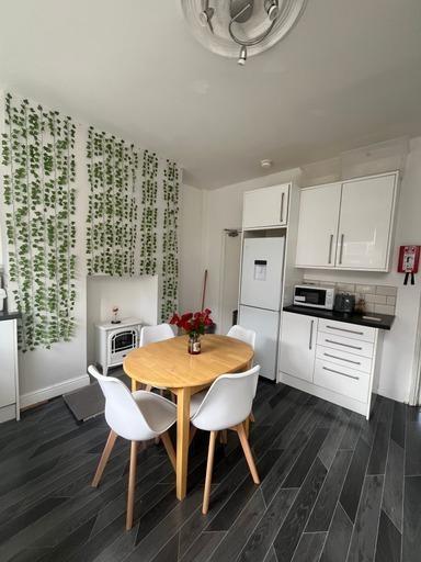 A bright and tidy kitchen area featuring a smal...