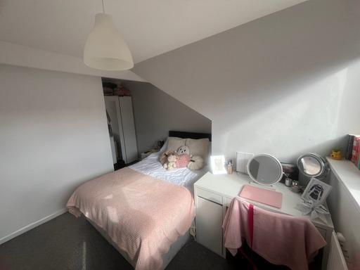 A spacious and well-maintained master bedroom w...