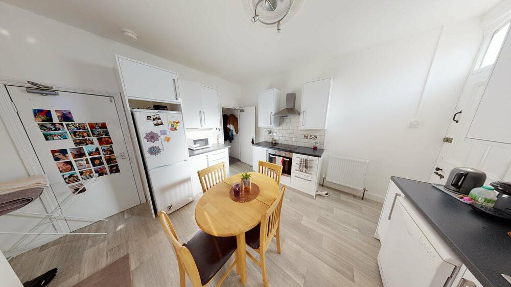 A spacious and well-lit contemporary living roo...