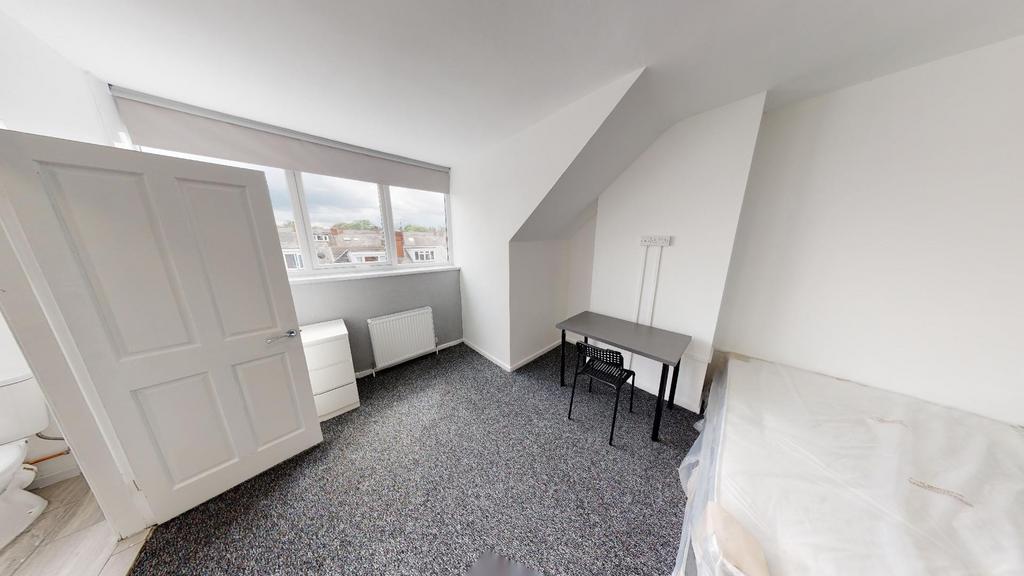 Spacious and bright master bedroom with ample n...