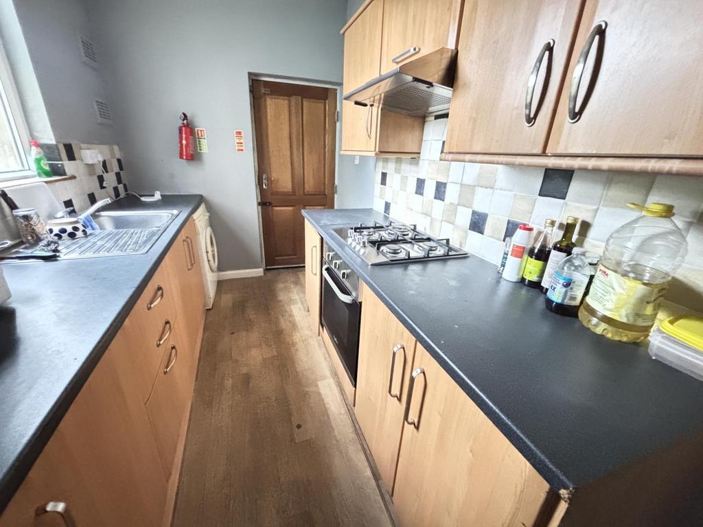 A well-maintained modern kitchen featuring wood...