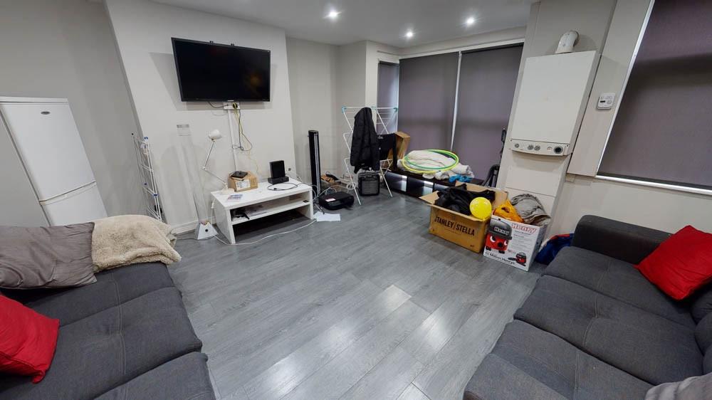 A spacious and well-lit contemporary living roo...