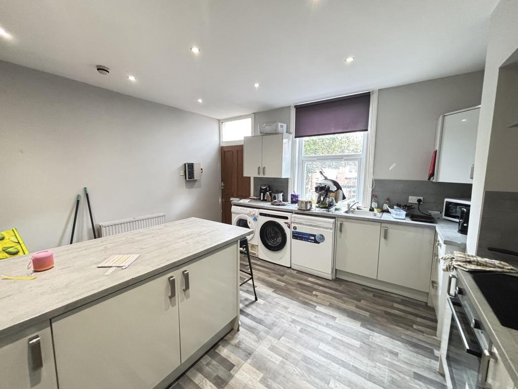 A modern, well-lit kitchen with ample workspace...