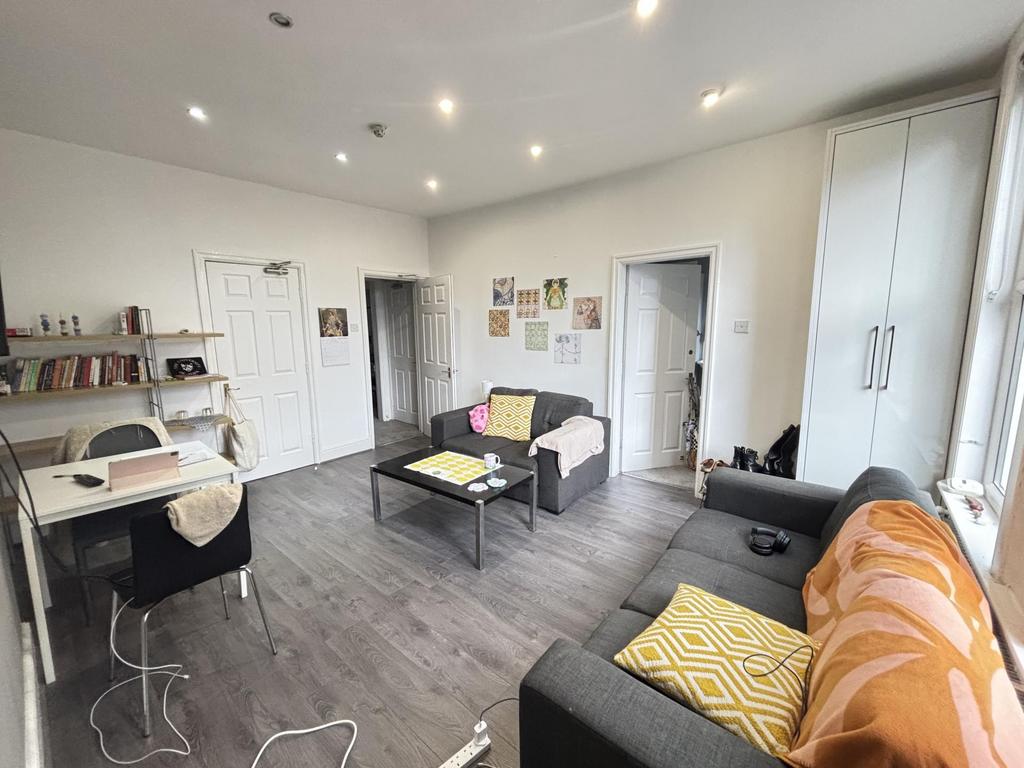 Bright and spacious living room featuring conte...