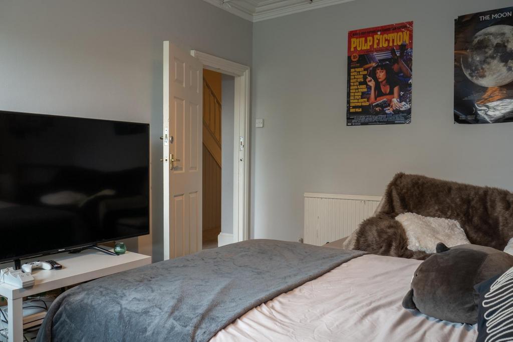 A spacious and well-maintained master bedroom f...