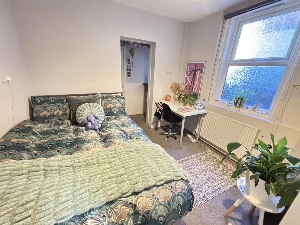 A bright and inviting bedroom with a spacious d...