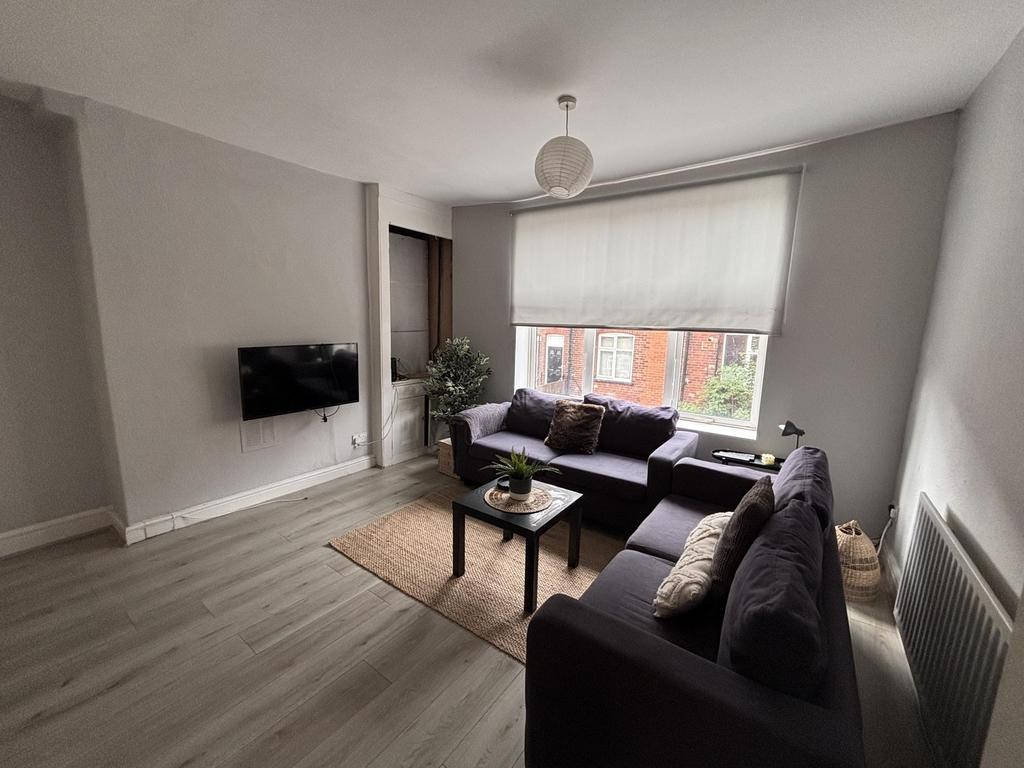A bright and modern living room with large wind...