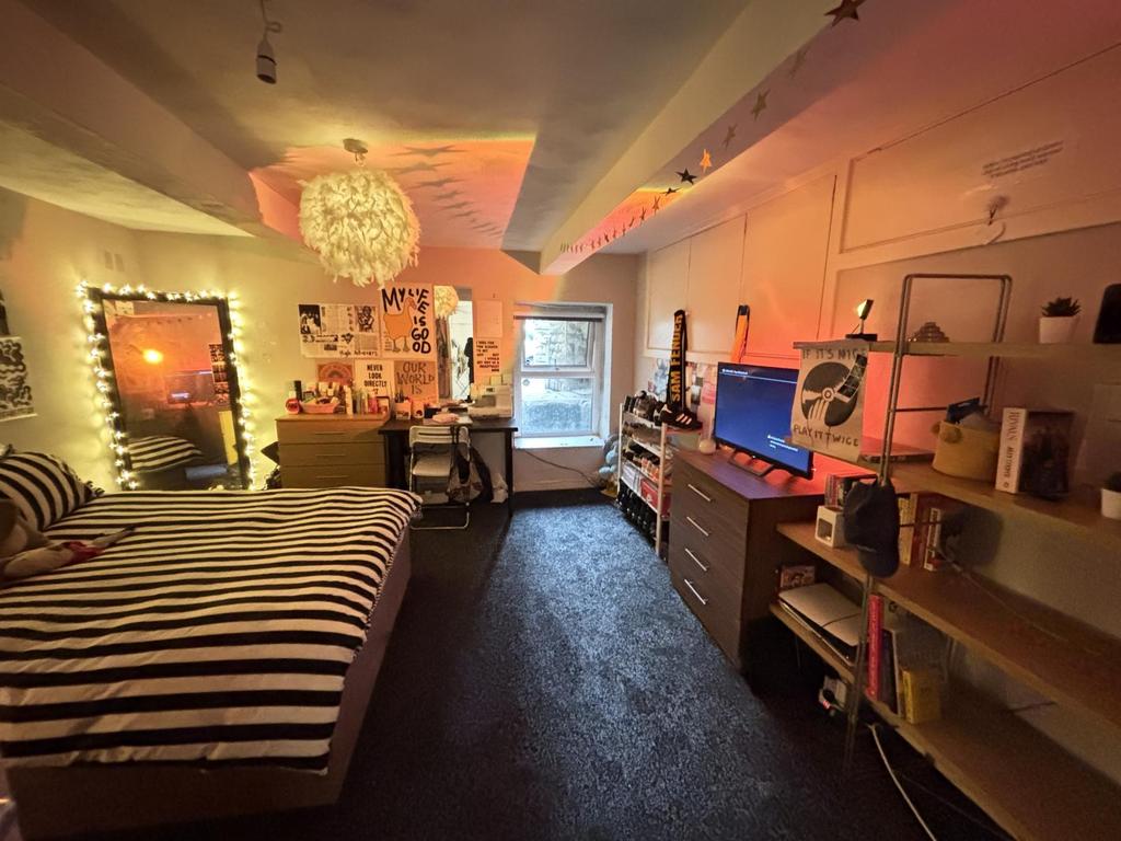 A cozy and inviting living room featuring conte...