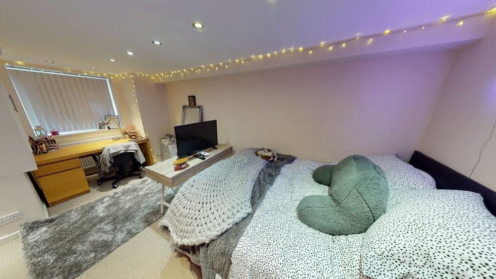 Bright and cozy bedroom featuring a double bed ...
