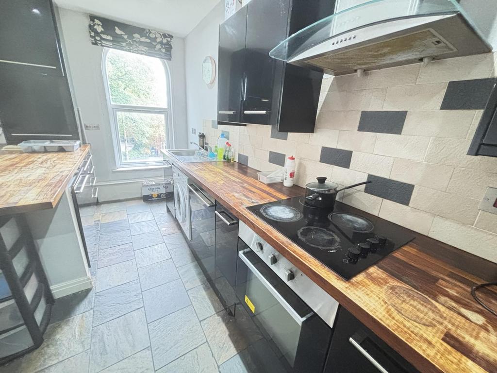 Bright and modern kitchen with ample natural li...