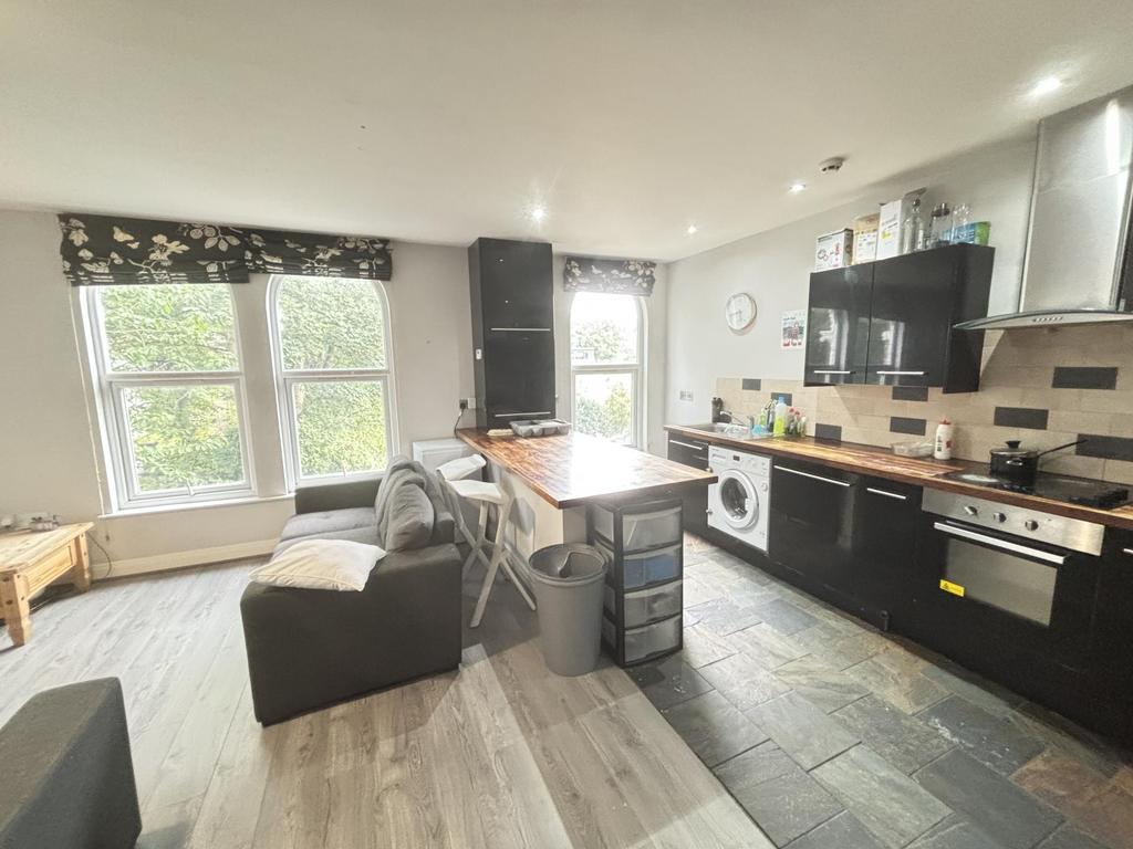 A modern and spacious living room featuring lar...