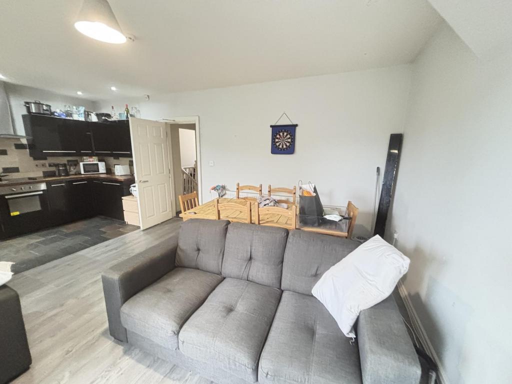 A bright and modern living room featuring a com...