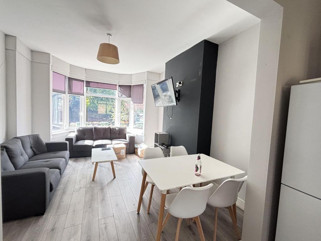 A bright and welcoming modern living room featu...