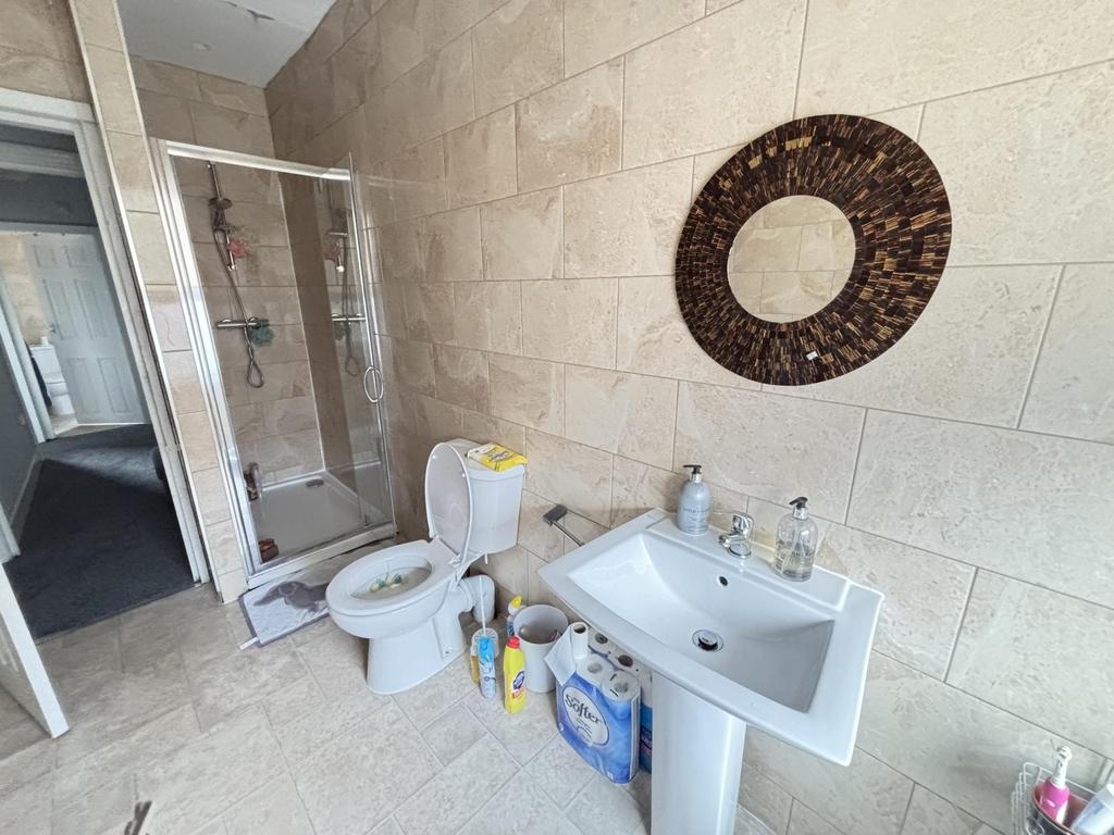 A well-maintained bathroom featuring a large sh...
