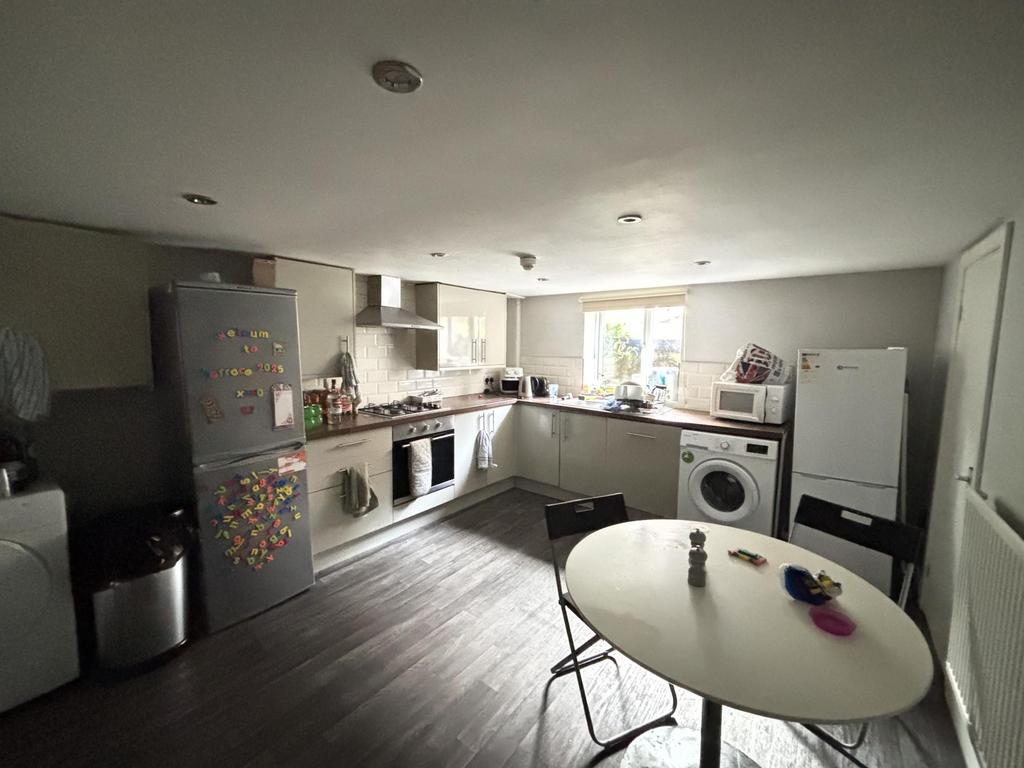 Bright and modern kitchen with ample natural li...