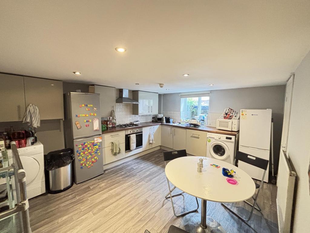 A modern, well-lit kitchen with ample counter s...