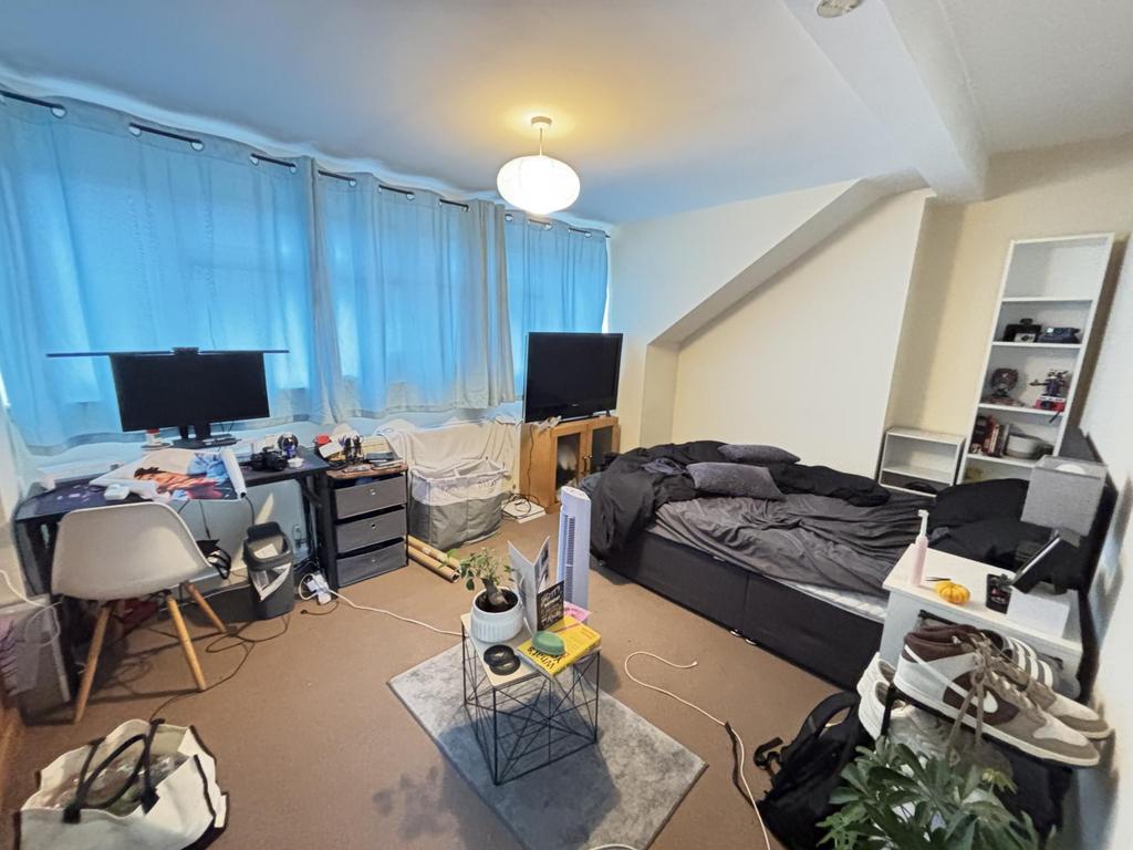 A cozy, comfortably furnished living room with ...