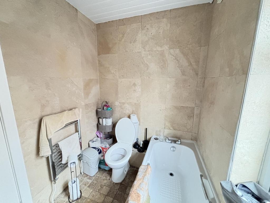 A clean and well-maintained bathroom with a toi...
