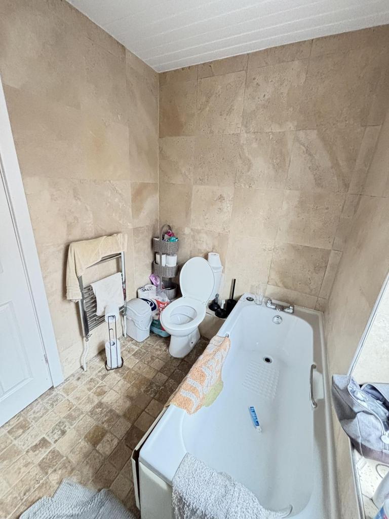 Bright and spacious bathroom featuring a large ...