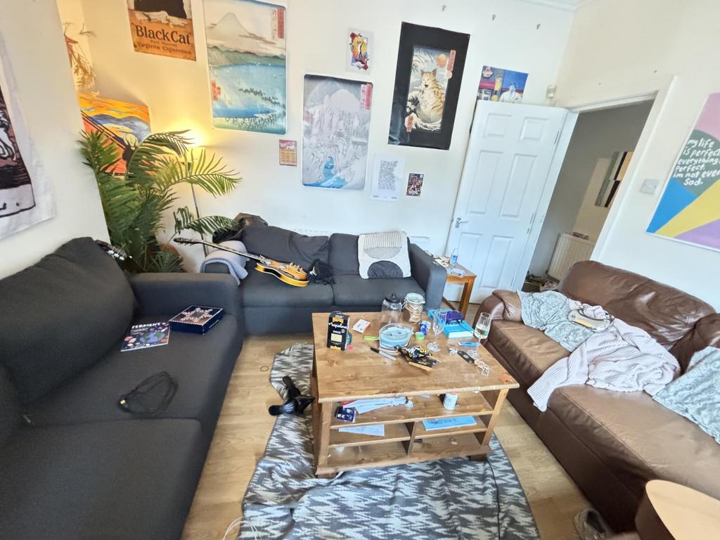 A cozy and casual living room featuring a sofa,...