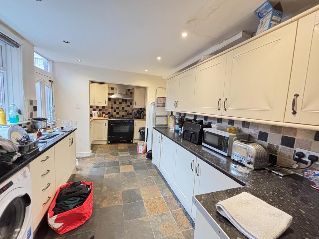 A bright and well-organized kitchen with modern...