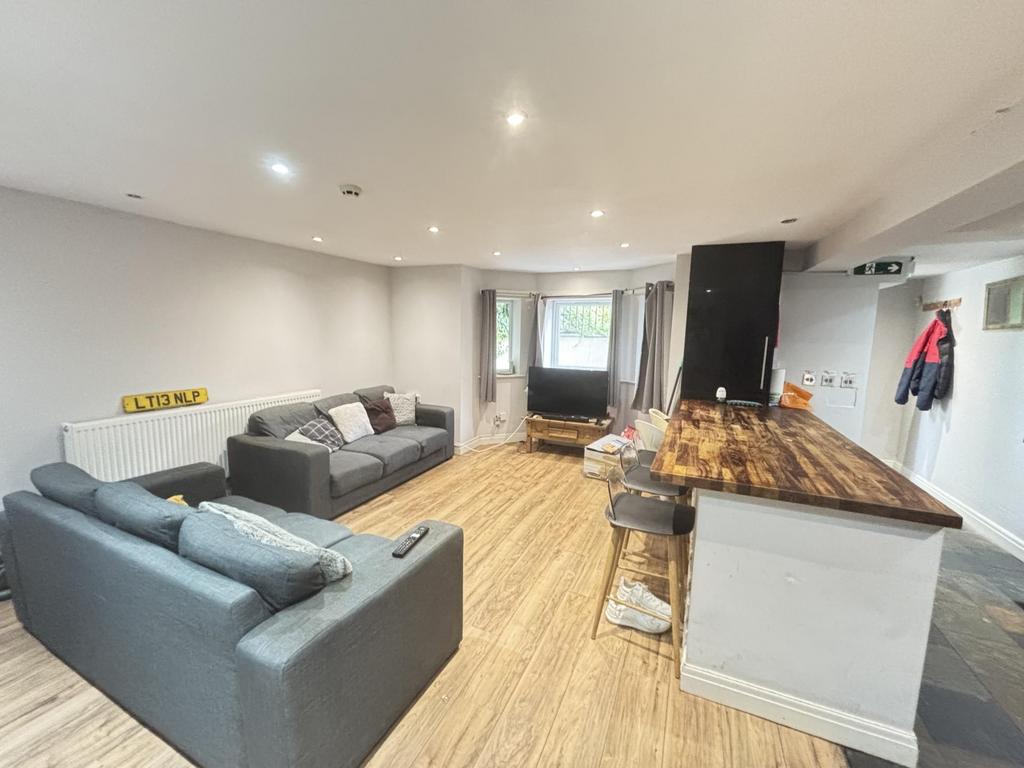 A spacious and modern living room with comforta...