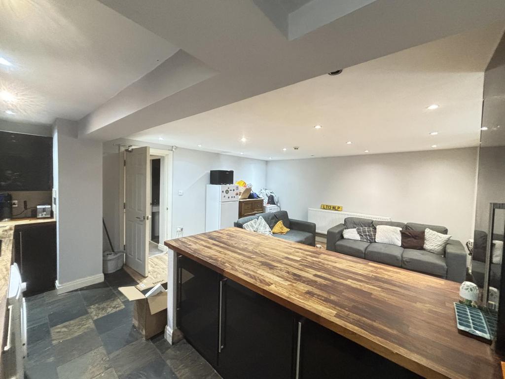 A spacious and modern living room featuring com...