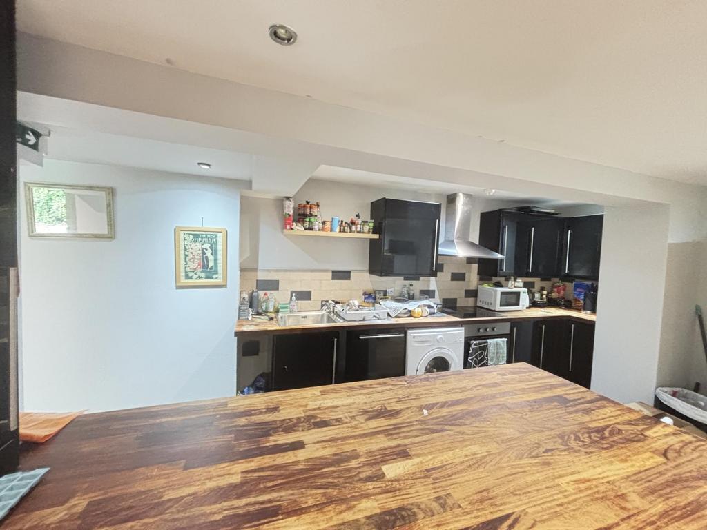 A bright and modern kitchen with ample workspac...