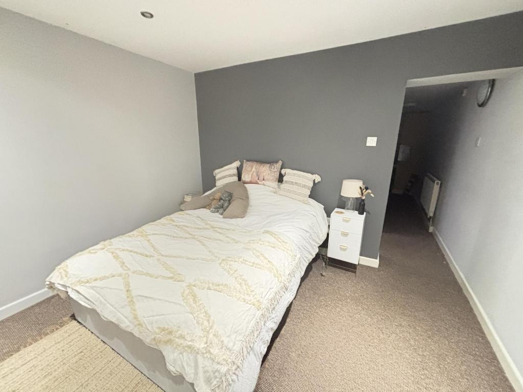 A bright and inviting double bedroom featuring ...