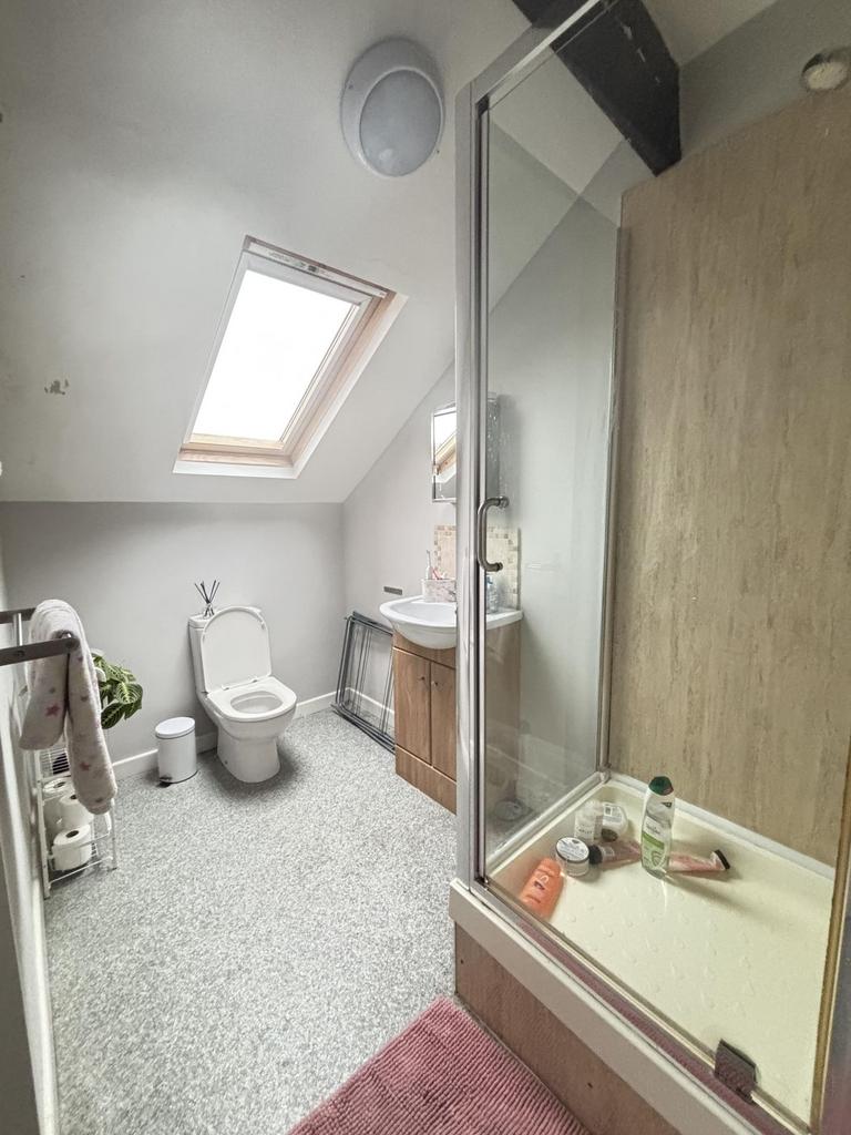 A bright, well-maintained bathroom featuring a ...