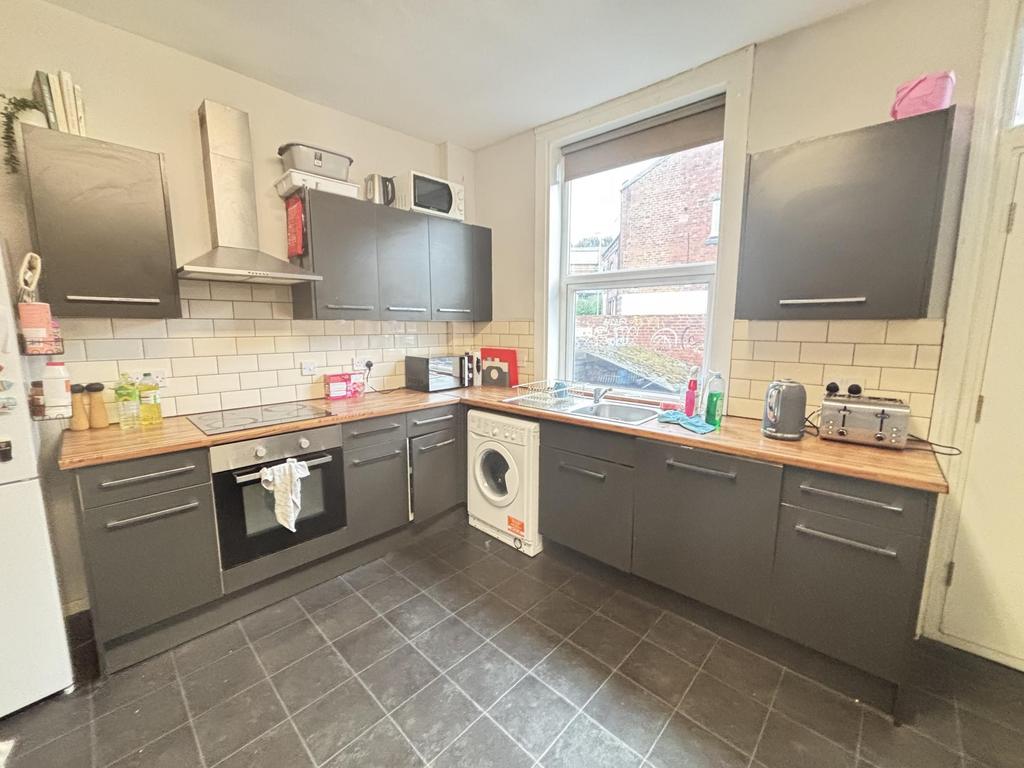 A modern kitchen with ample cabinetry and a lar...