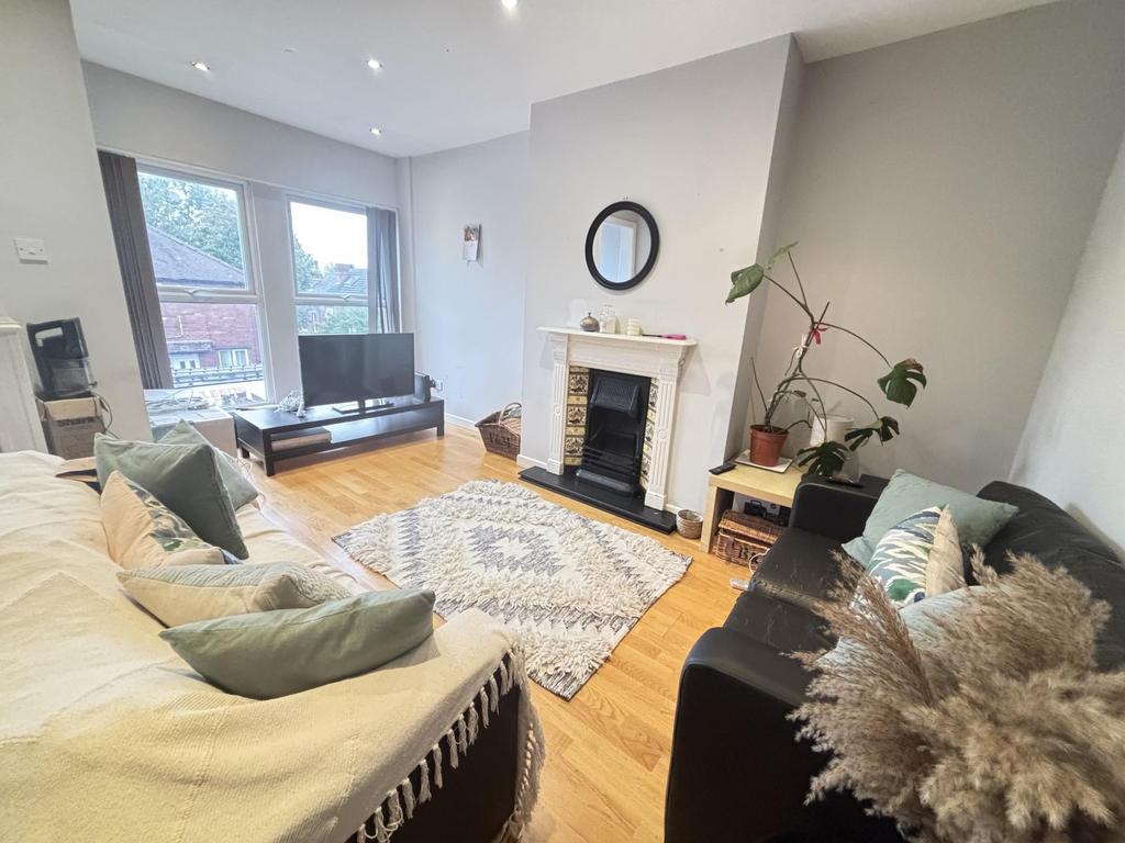 A spacious and inviting living room featuring l...