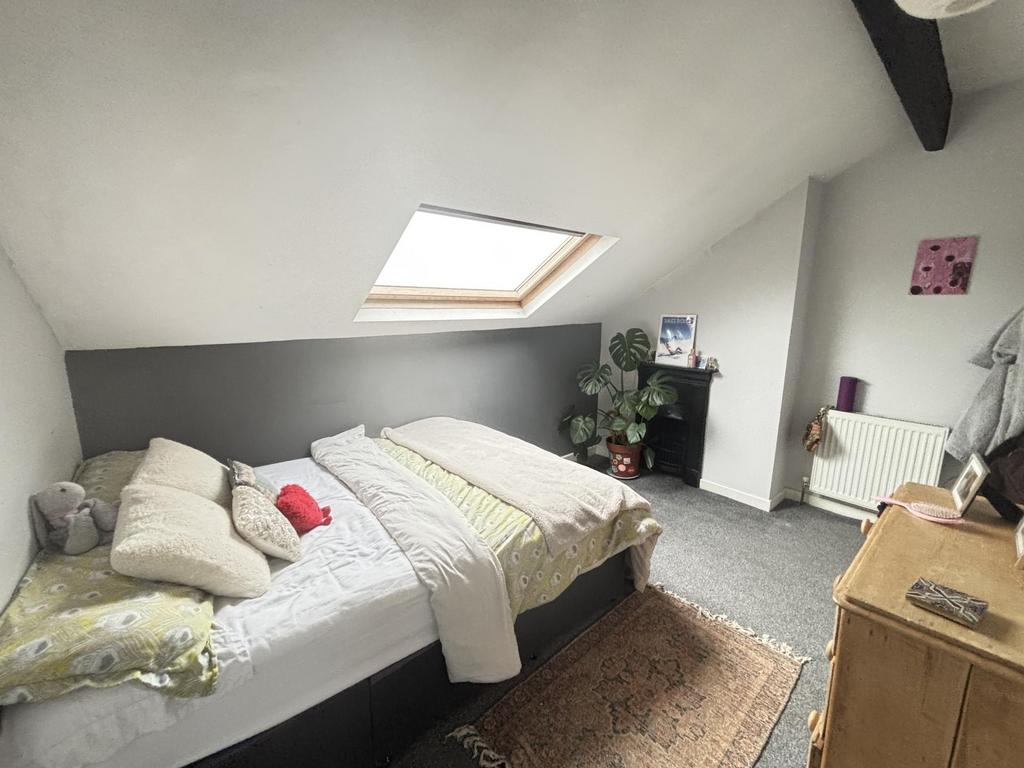 Bright and spacious master bedroom featuring a ...