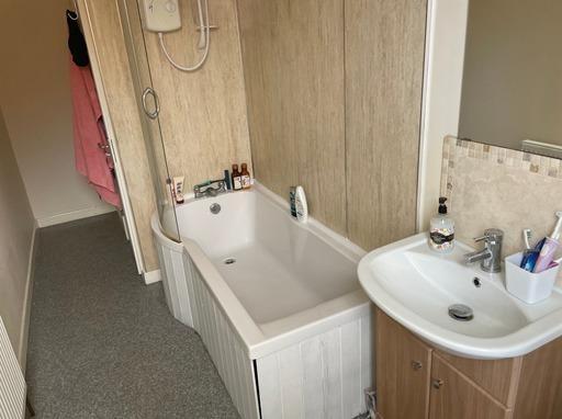 A clean and well-maintained bathroom with a bat...