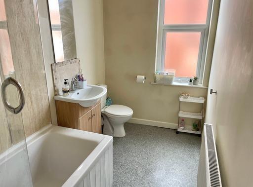 A clean and well-maintained bathroom featuring ...