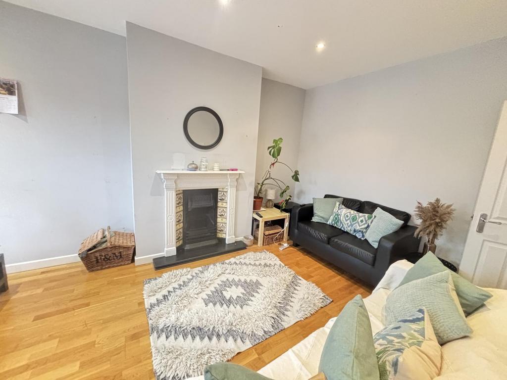 Bright and welcoming living room featuring mode...