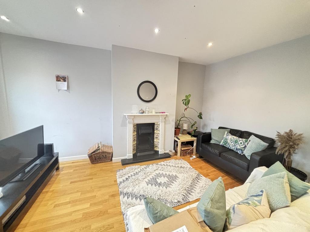 Bright and modern living room featuring ample n...