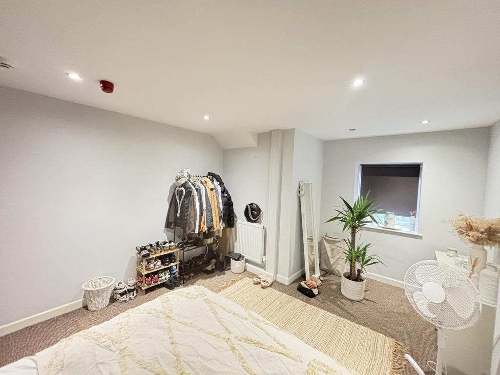 Bright and modern living room with ample natura...