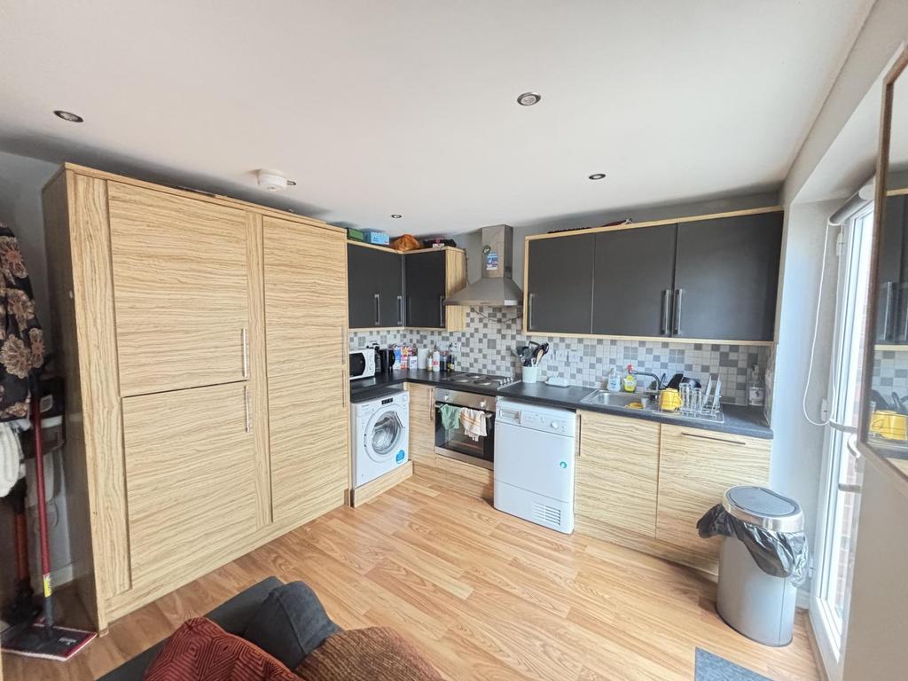 A modern kitchen featuring ample work surfaces,...