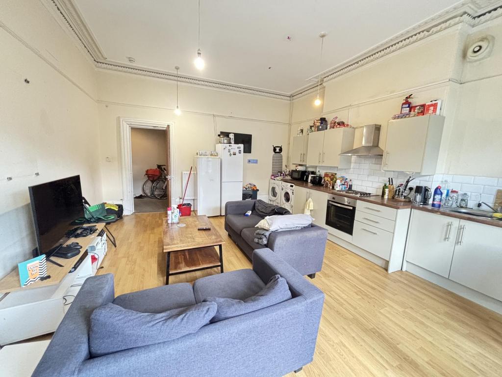 A spacious and well-lit contemporary living roo...